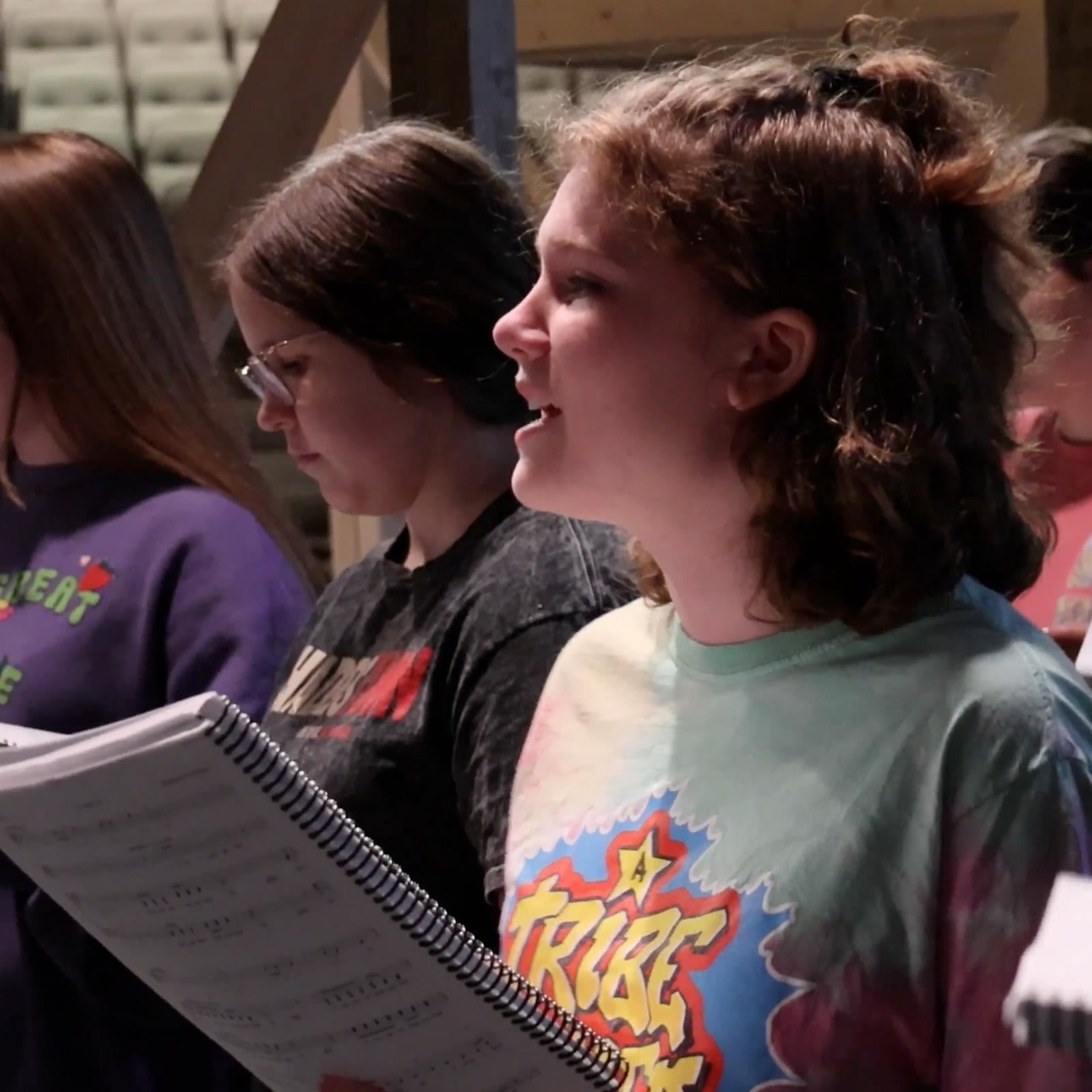  A student sings during rehearsals for the summer musical